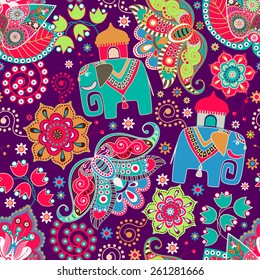 Floral seamless pattern with decorative flowers and elephants