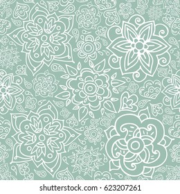 Floral seamless pattern with doodle flowers and leaves. Vector hand drawn pattern in blue and white. Seamless pattern can be used for wallpapers, pattern fills, web page backgrounds.