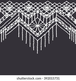 Floral seamless pattern with a fringe border knitted or woven macrame in boho style 