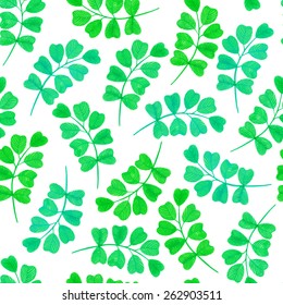 Floral seamless pattern with green leaves and branches on white background. Vectorized watercolor drawing.