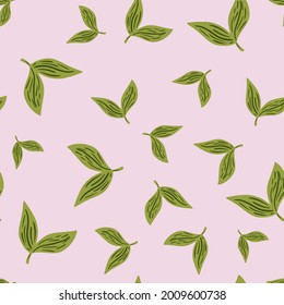 Patrón floral sin soldadura con siluetas verdes de hojas aleatorias. Fondo rosa pastel. Impresión herbal. Ilustración vectorial para impresiones textiles estacionales, tela, carteles, telas de fondo y papel pintado.