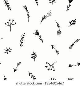 Floral seamless pattern with hand drawn elements in black on white background.