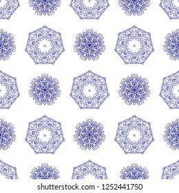 Floral seamless pattern. Mandala flower decorative elements. Ethnic abstract ornament. Oriental style background. Blue flowers on white background monochrome. Minimal flower pattern.