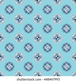 Floral seamless pattern on a blue background. Vector illustration.