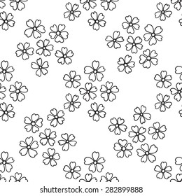 Floral seamless pattern in the plant design. Black and white small flowers on a white background.