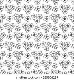 Floral seamless pattern in the plant design. Black and white graphics, flowers on a white background, painted hands.