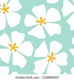 Floral seamless pattern in scandinavian style. Decorative hand drawn tropical plumeria flowers. Modern floral background. White plumeria flower on a blue background for print, textile, fabric. 