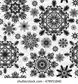Floral seamless pattern with stylized snowflakes. Gray snowflake on white background.