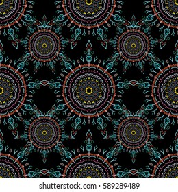 Floral seamless pattern. Wallpaper baroque, seamless vector background, blue, pink and orange on black background.