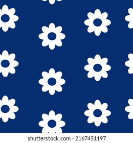 Floral seamless pattern with white daisy flowers on deep blue background texture vector. Textile fabric print. Gift wrapping paper. Backdrop. Repeating tile. Abstract design template element.