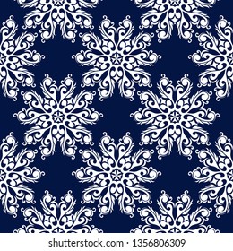Floral seamless pattern. White flower decorations on dark blue background