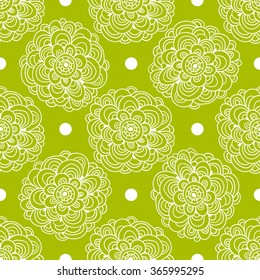 Floral seamless pattern. White flowers and circles on a green background, hand drawn, vector.