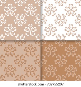 Floral seamless patterns. Set of brown white abstract flower designs for fabrics and wallpapers. Vector illustration