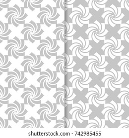 Floral seamless patterns. Set of light gray vertical backgrounds for fabrics and wallpapers