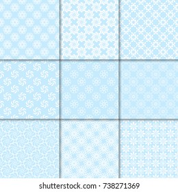 Floral seamless patterns. Set of navy blue backgrounds with flower elements for fabrics and wallpapers