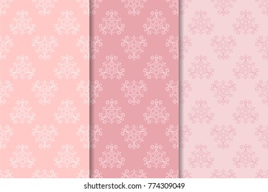 Floral seamless patterns. Set of pale pink abstract flower designs for fabrics and wallpapers. Vector illustration