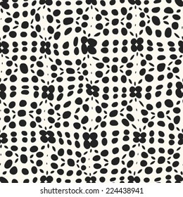 Floral spot background in black and white. Seamless pattern. Vector.