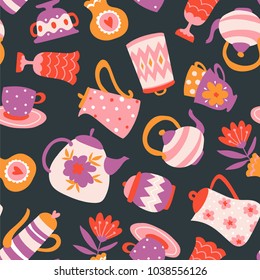 Floral Tea seamless pattern. Cute fabric design. Teapots, cups and flowers isolated on the dark background.