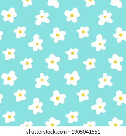 Floral vector seamless pattern with camomile on a blue background in flat style. Trendy bright chamomile summer background vector.
