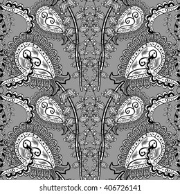 Floral vertical pattern, doodles,bagels, branches, leaves, seamless, copy space. Hand drawn. Gray background. Vector illustration.