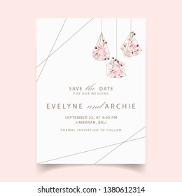 floral wedding invitation with cherry blossoms in terrarium