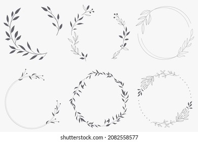 Floral Wreath branch in hand drawn style. Floral round gray and white frame of twigs, leaves and flowers. Frames for the Valentine's day, wedding decor, logo and identity template.