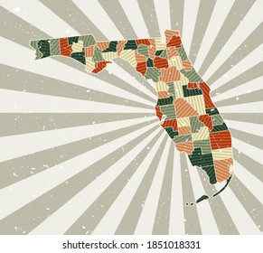 Florida vintage map. Grunge poster with map of the us state in retro color palette. Shape of Florida with sunburst rays background. Vector illustration.