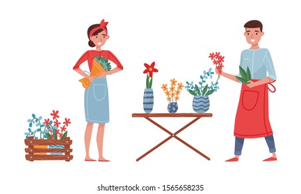 Floristry Concept. Flower Arrangers Taking Care of Plants and Flowers