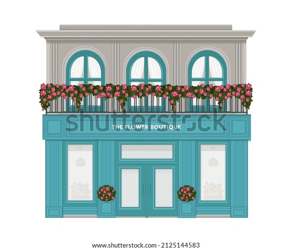 Flower boutique. Facade of a flower shop.\
florist shop facade decorated with flowers. Vintage boutique.\
Building with a balcony decorated with\
flowers