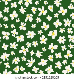 Flower heads seamless repeat pattern. Random placed, vector ditsy daisy floral all over surface print on green background.