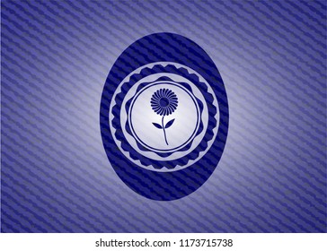 flower icon inside badge with denim texture