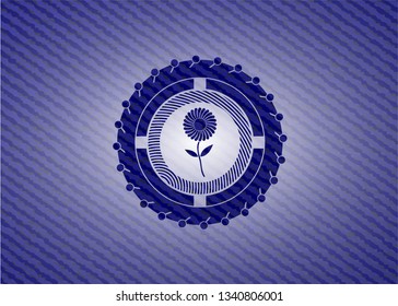 flower icon inside badge with denim background