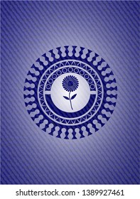 flower icon inside badge with denim texture