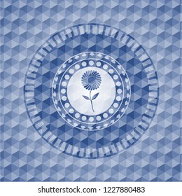 flower icon inside blue badge with geometric pattern.