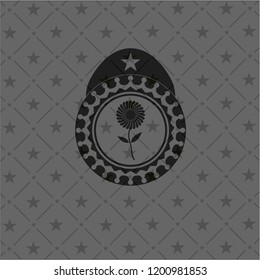 flower icon inside dark emblem