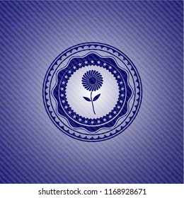 flower icon inside emblem with jean texture