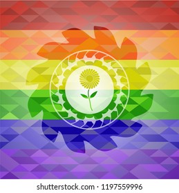 flower icon inside emblem on mosaic background with the colors of the LGBT flag