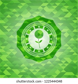flower icon inside green emblem with mosaic background