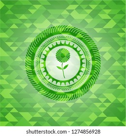 flower icon inside green emblem with mosaic ecological style background