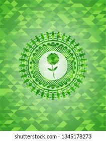 flower icon inside green emblem. Mosaic background