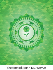 flower icon inside green mosaic emblem