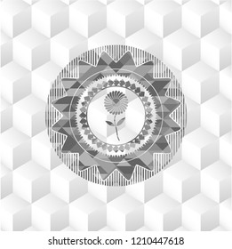 flower icon inside grey emblem with cube white background
