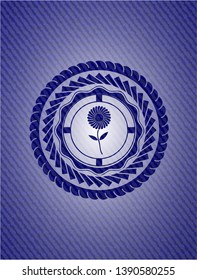 flower icon inside jean or denim emblem or badge background