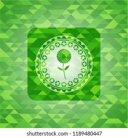 flower icon inside realistic green emblem. Mosaic background