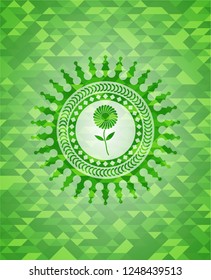 flower icon inside realistic green mosaic emblem