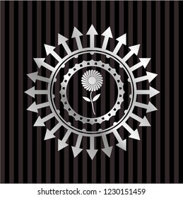 flower icon inside silver emblem or badge