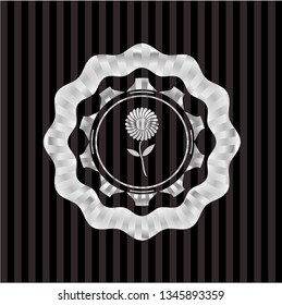 flower icon inside silver emblem