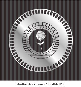 flower icon inside silver emblem