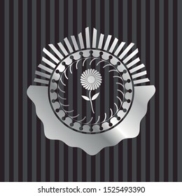 flower icon inside silver emblem