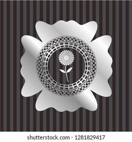 flower icon inside silvery badge